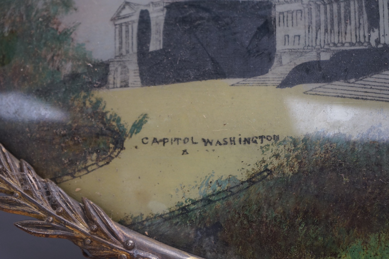 20th century School, reverse glass painted convex oval panel, ‘Capital Washington’, 34 x 48cm. Condition - poor